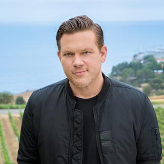 Host Tyler Florence posing in the Catalina View Gardens located in Palos Verdes, CA., as seen on Food Network's The Great Food Truck Race, Season 7.