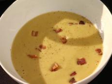 Transform fresh pumpkin into a silky Pumpkin Soup recipe from Food Network imbued with fresh sage, cream and apple.