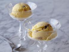 Chocolate chip cookie dough is mixed into a rich vanilla ice cream base in this chocolate chip cookie dough ice cream recipe from Food Network.