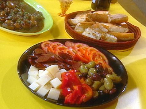 Crusty Bread, Sliced Tomatoes with Lemon, Sliced Pimentos, Spanish Cheese and Olives
