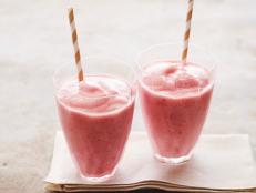 No need for ice in these Frozen Fruit Smoothies from Food Network Kitchen: Frozen bananas and berries add a rich, creamy thickness with milk, yogurt and honey.