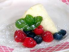 I learned to make and love lemon curd while living in England. This does it one better, lightening it with whipped cream to make a foolproof frozen mousse. My mother Myrna loved lemon so on Mother's Day that's what I think to make. Serve this for breakfast with mixed berries in season or as a dessert with poached peach halves and raspberry sauce, sort of an updated Peach Melba.