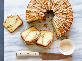 SOUR CREAM COFFEE CAKE, Ina Garten, Barefoot Contessa/Girls Day Off, FoodNetwork, Unsalted Butter, Sugar, Eggs, Vanilla Extract, Sour Cream, Cake Flour,Baking Powder, Baking Soda, Light Brown Sugar, Cinnamon, AllpurposeFlour,Walnuts, Confectionersâ   Sugar, Maple Syrup