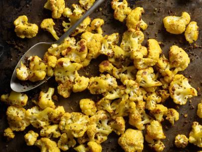 Bobby Flay's Oven Roasted Cauliflower with Turmeric and Ginger, as seen on Boy Meets Grill, Indian.
