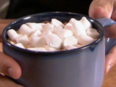 Skip the store and make sweet treats at home with Alton Brown's Homemade Marshmallows recipe from Good Eats on Food Network.