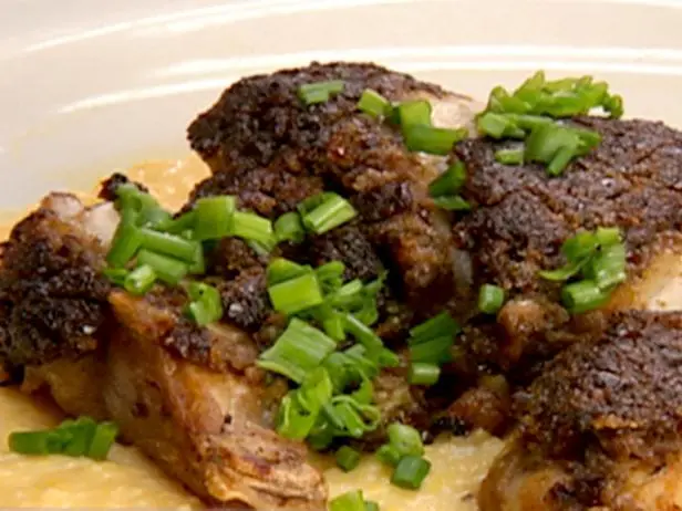 Sun-Dried Tomato Pesto-Crusted Chicken Breast over Creamy Herb Polenta Recipe | Robert Irvine | Food