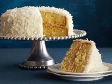 Celebrate with Ina Garten's snow-white Coconut Cake recipe from Barefoot Contessa on Food Network. The cream cheese frosting is sprinkled with shredded coconut.