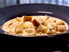 For a bowl of creamy comfort, try Dave Lieberman's New England Clam Chowder recipe from Food Network, perfect with homemade baguette croutons.