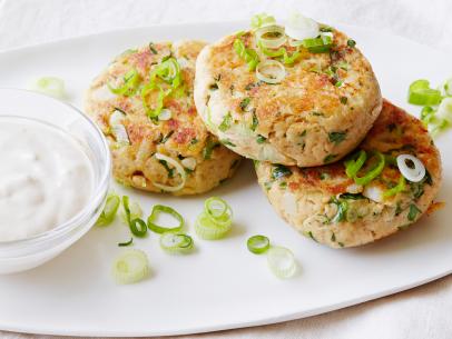SALMON CAKES WITH CREAMY GINGER SESAME SAUCE, Ellie Krieger, Healthy Appetitewith Ellie Krieger/Meals Deals, Food Network, Whole-wheat Sandwich Bread, CannedSalmon, Eggs, Scallions, Water Chestnuts, Cilantro, Olive Oil, Plain Yogurt, Mayonnaise,Ginger, Sesame Oil, Soy Sauce