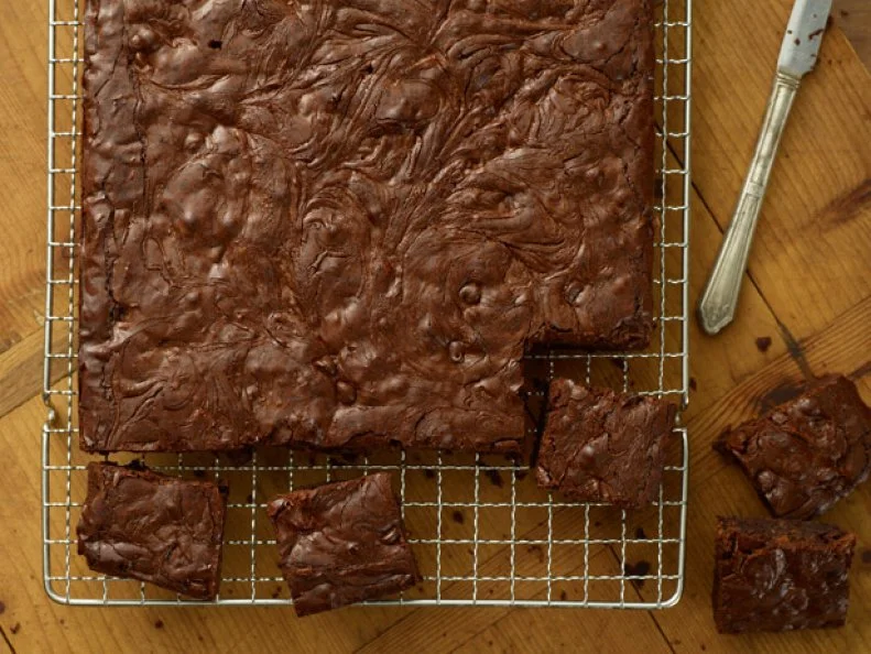 Peanut swirl brownies on a cooling rack.