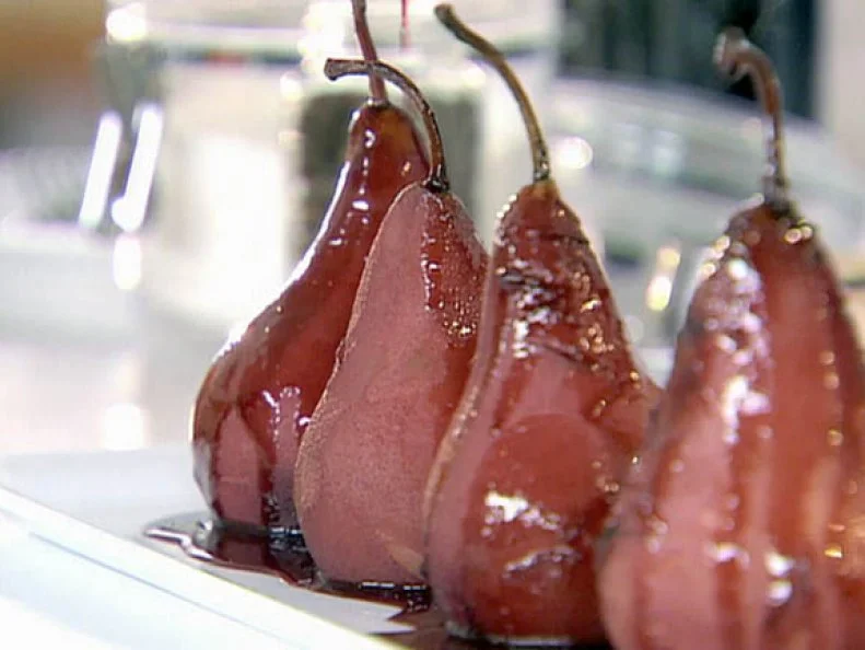Frame 884
Ellie Krieger's peeled pears are boiled then covered in red wine syrup. Served on Healthy Appetite as a light fruity dessert.   