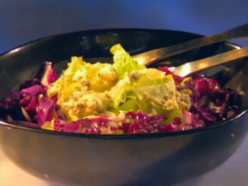 Frame 621
Guy Fieri's Long Beach Coleslaw is made with red cabbage and iceberg lettuce. Coated with blue cheese dressing, the coleslaw is paired with the Bad Boy Beef sandwich on Guy's Big Bite. 