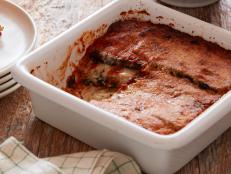 Layer this cheesy, saucy Eggplant Lasagna recipe from Food Network for a hearty vegetarian Italian meal.
