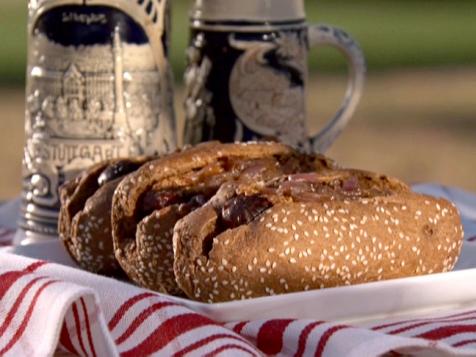 Wisconsin Beef and Cheddar Brats with Beer-Braised Onions