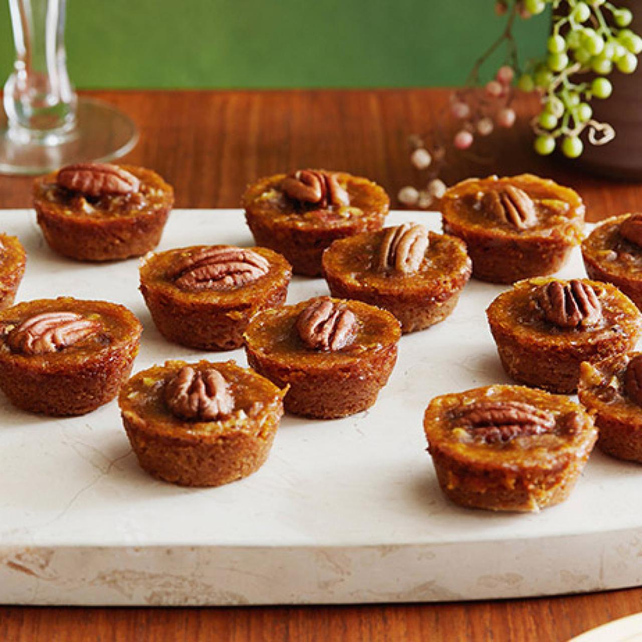 https://food.fnr.sndimg.com/content/dam/images/food/fullset/2008/11/26/1/RE0212_Mini-Pecan-Pumpkin-Pies.jpg.rend.hgtvcom.1280.1280.suffix/1382544972900.jpeg