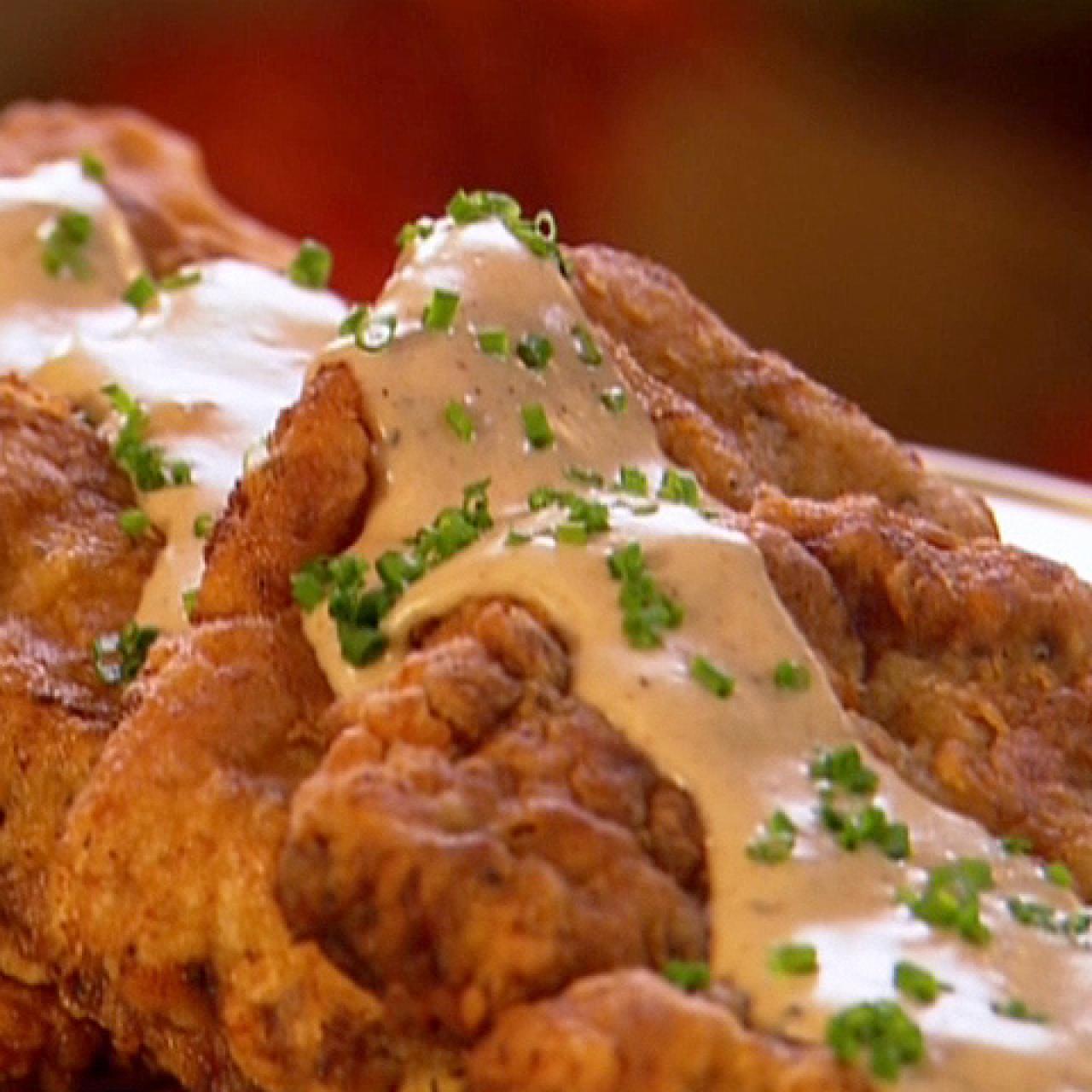 https://food.fnr.sndimg.com/content/dam/images/food/fullset/2008/12/1/0/NY0306_Chicken-Fried-Steak.jpg.rend.hgtvcom.1280.1280.suffix/1383003951075.jpeg