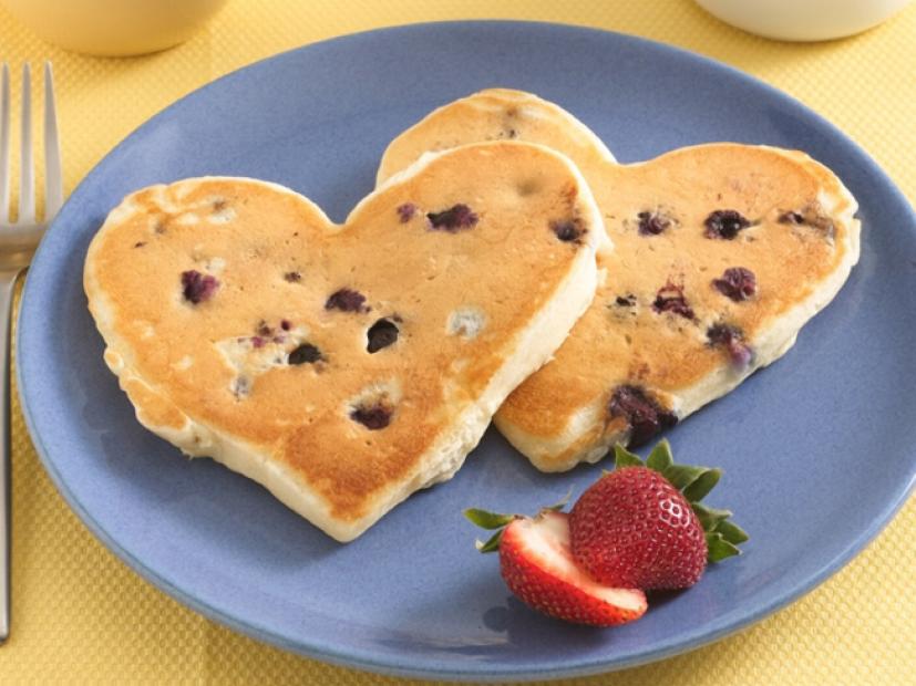 Bisquick sponsored image - Blueberry pancakes in the shape of hearts. 