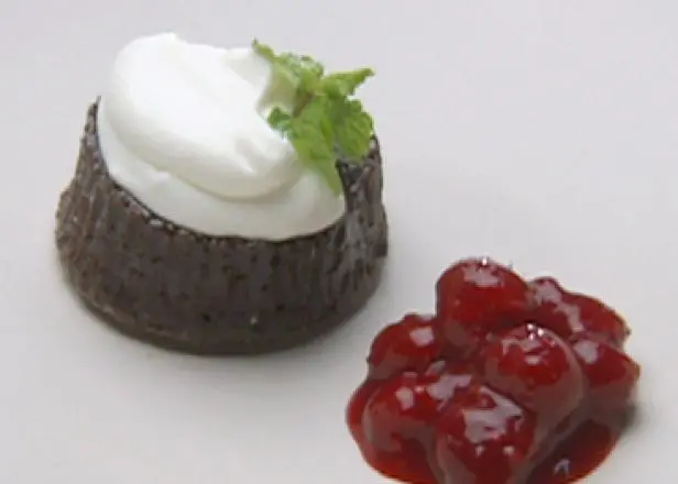 Warm Chocolate Gateaux Topped with Sour Cream Quenelle and Raspberry Sauce Recipe | Robert Irvine | 
