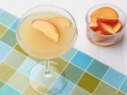 Chef Name: Guy FieriFull Recipe Name: Peach MartiniTalent Recipe: Guy Fieriâ  s Peach Martini, as seen on Guyâ  s Big BiteFNK Recipe: Project: Foodnetwork.com, WINTER RECIPES/COCKTAILS/FNK VIDEOSShow Name: Guyâ  s Big BiteFood Network / Cooking Channel: Food Network