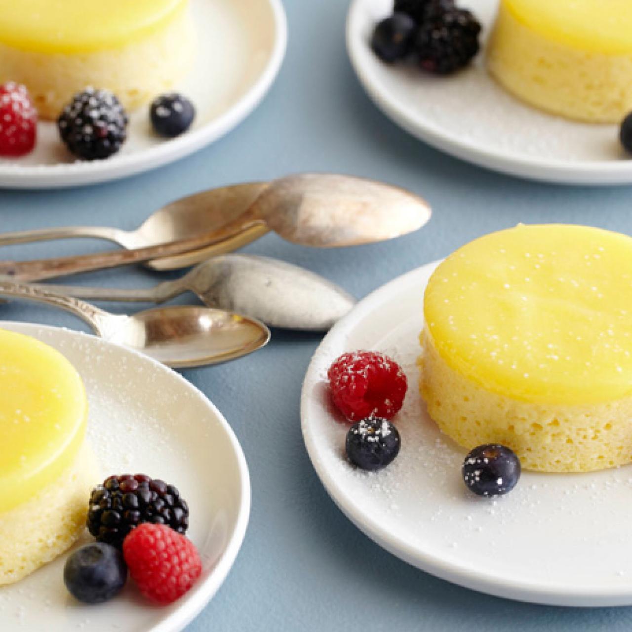 https://food.fnr.sndimg.com/content/dam/images/food/fullset/2008/5/4/0/TU0505_Lemon-Pudding-Cake-with-Berries.jpg.rend.hgtvcom.1280.1280.suffix/1371585698439.jpeg