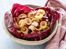 The dressing for this salad dressing combines a favorite flavor combo of mine, orange and oregano. The pasta is tossed with the sweet-tangy dressing, bitter red greens and onions. It may not be for everyone but it's definitely a favorite of mine.