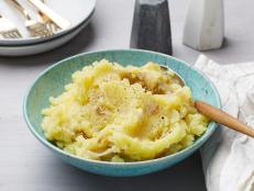This mash owes its luxurious texture to the natural creaminess of Yukon gold potatoes and a touch of olive oil. At first glance 4 cloves of garlic may seem like a lot, but the garlic mellows as it steams with the potatoes so when they are mashed together you get just the right garlic infusion.