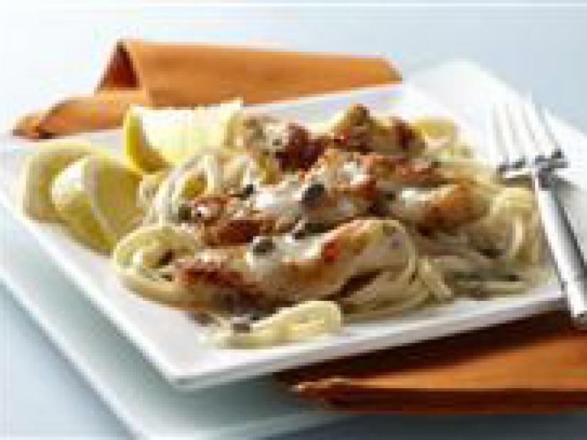 Lemon Chicken on a Bed of Pasta Placed on a Square Contemporary Style Plate