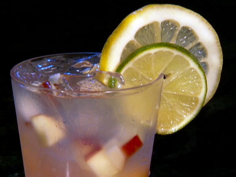 White Sangria Garnished with a Lime and Lemon Slice for Tailgating