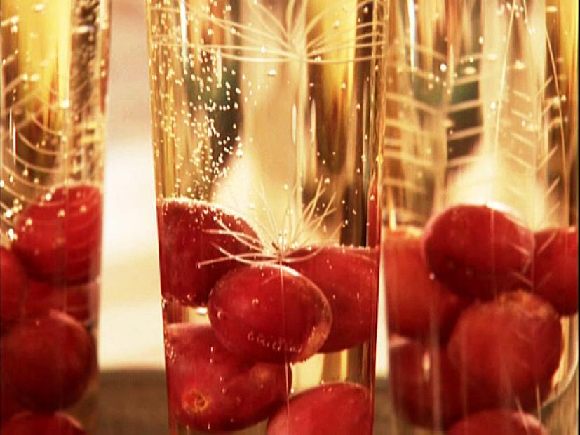 Long Stem Glasses containing red seeless grapes and Grape Spritzer