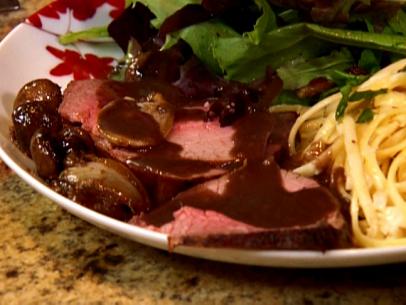 Roast Beef with mushrooms covered in gravy