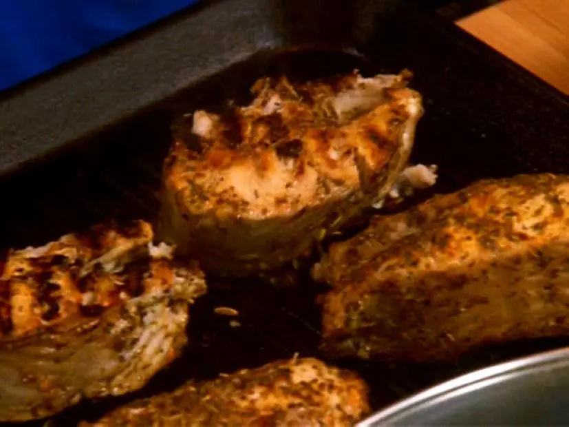 Four catfish fillets on a grill