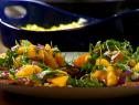 Chicken Cutlets covered with pieces of Oranges and Arugula Leaves
