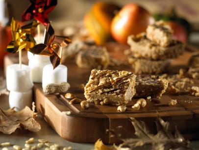 Rice Krispies Peanut Butter Bars on a table with Thanksgiving decorations