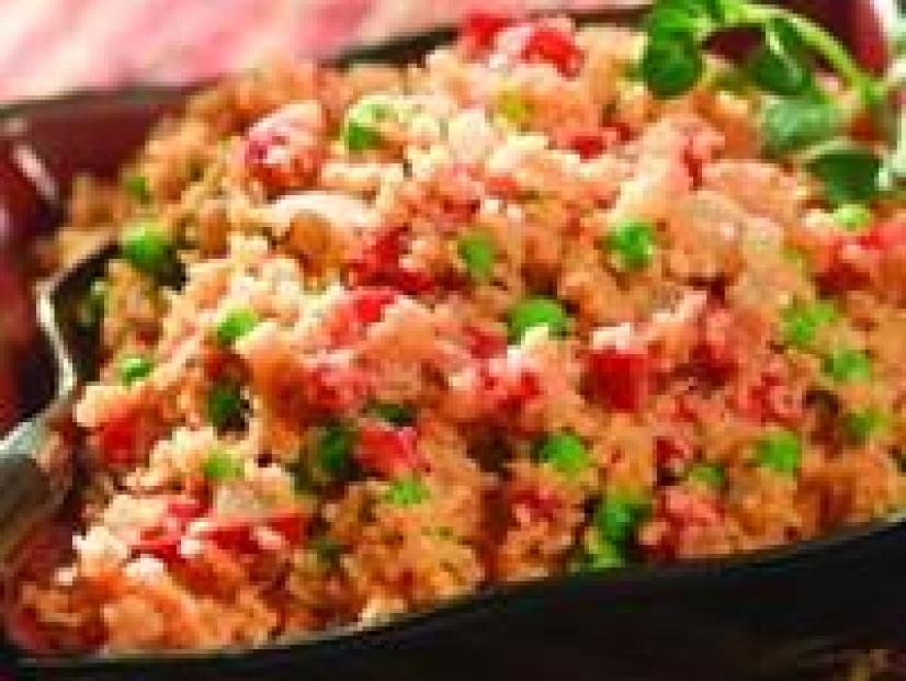 Moroccan Peanut Couscous with Peas in a square wavy dish