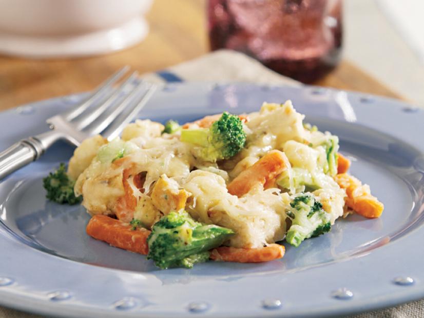 Turkey Casserole with broccoli and carrots on a blue plate