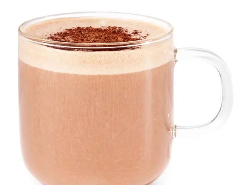 Banana Coco Sprinked with Chocolate Shavings in a Glass Mug against a White Background