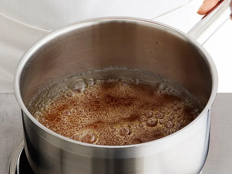 Caramel Simmering inside of a Saucepan