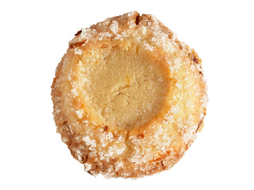 A Lemon sugar cookie sprinkled with sugar placed against a white background