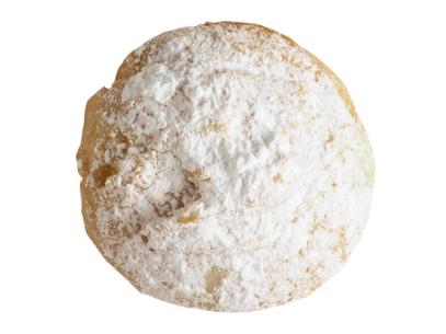A Mexican wedding cookie covered with powder sugar