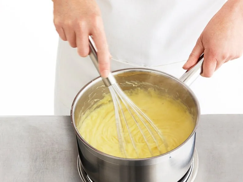 Whisking the Ingrdients for Pastry Creme in a Sauce Pan