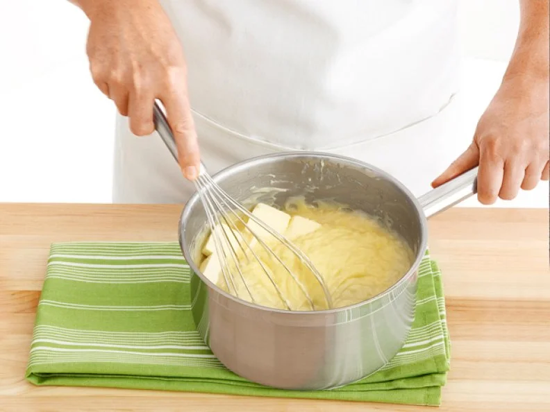 Whisking Ingredients Together To Create Pastry Creme