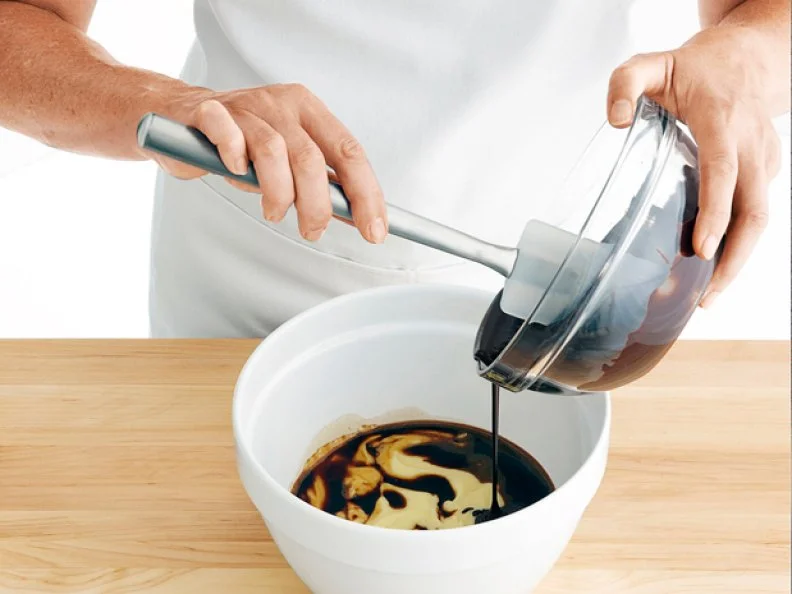 Pouring Ingredients into a Mixing Bowl to Create Pastry Creme