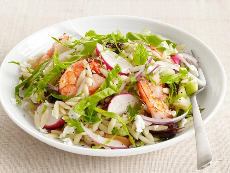 Shrimp Orzo Topped with Greens, Herbs, Red Onions and Beets in a White Bowl