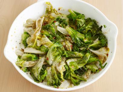 Spicy Escarole with crushed red pepper flakes in a plain white dish