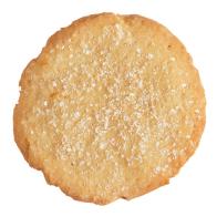 A basic sugar cookie against a white background