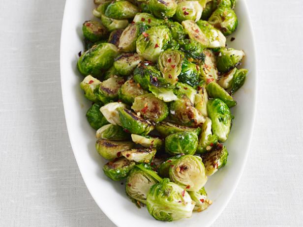Brussel Sprouts with crushed red peppers in a White Boat Shaped Dish
