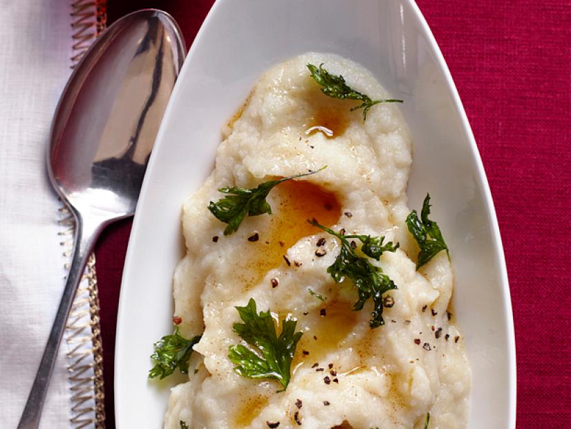 Mashed Potatoes with Cracked Pepper and Herbs in a White Boatshaped Dish