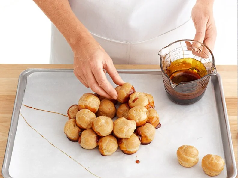 Round Pastries Stacked and Glued Together Using Caramel