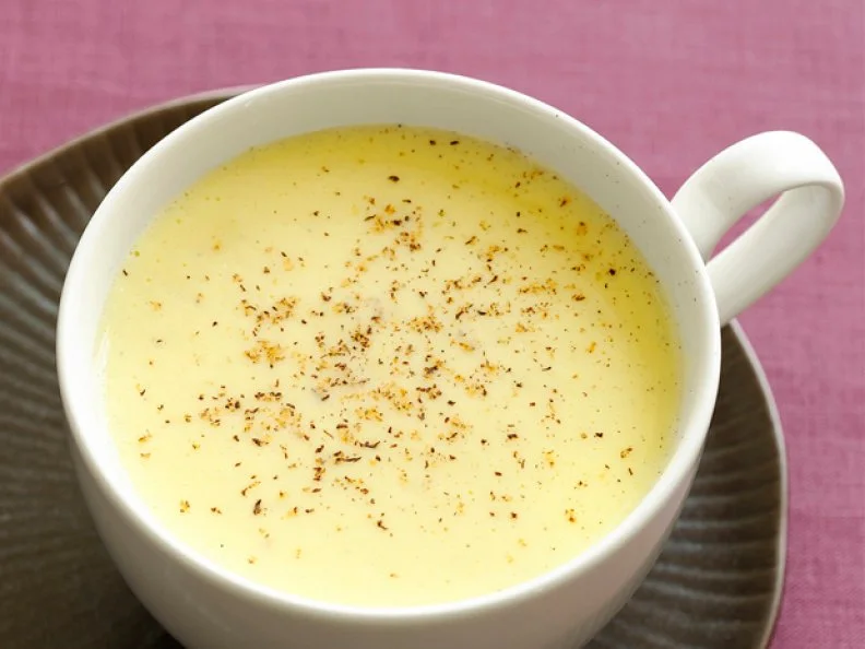 Eggnog with Spices Sprinkled on Top in a White Mug