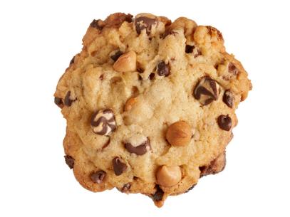 A chewy mixed chips cookie placed against a white background